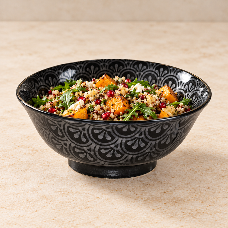MY578-GSG black-and-silver bowl holding pale grains, orange squash, green leaves, red seeds and white crumbles, with its upper interior pattern visible.