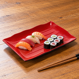513-BR black and red serving piece with a modest sushi assortment. Serving suggestion.