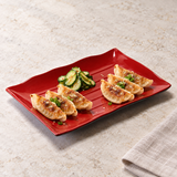 513-BR black and red serving piece with gyoza and cucumber. Serving suggestion.