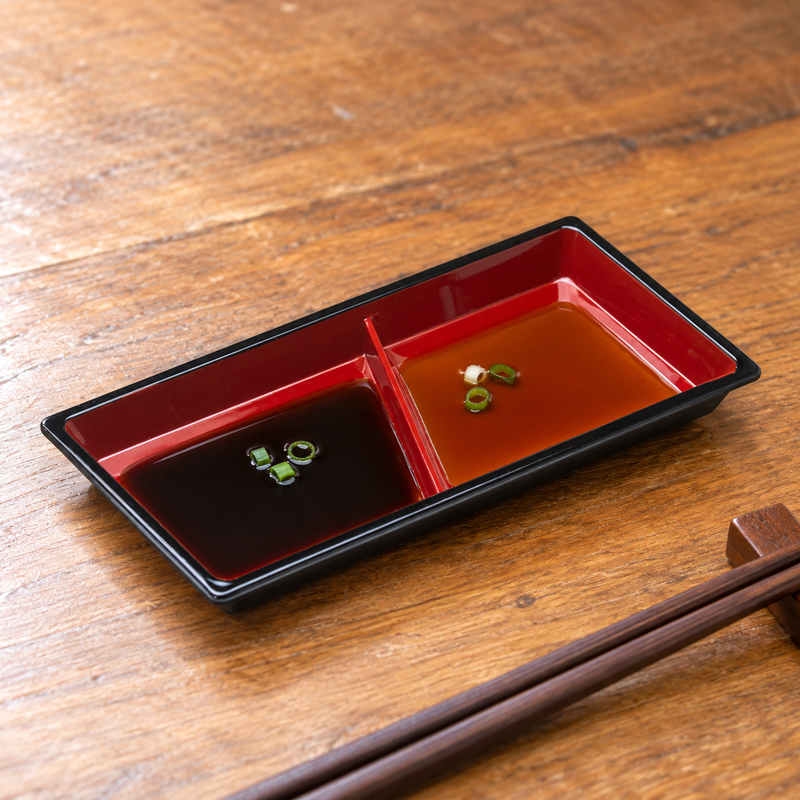 WO-12 black and red serving piece with two shallow sauce servings. Serving suggestion.