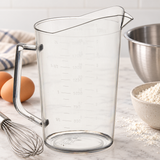 Empty measuring cup with separate baking preparation tools and ingredients