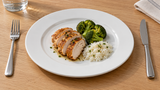 RCN-20 white porcelain round dinner plate with sliced chicken, broccoli and rice