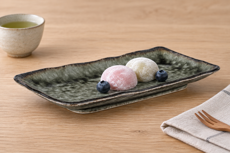 RT2112-GI green rectangular porcelain platter with mochi and blueberries on a wood table