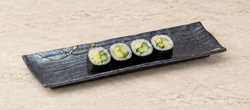 RUS213-L: 13.25" x 4.5" Rectangular Serving Platter, Black. Restaurant serving context