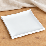 White square porcelain plate in a natural tabletop setting