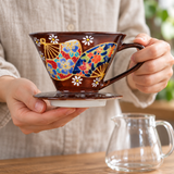 SFD1-7056 patterned coffee dripper held by handle with base supported