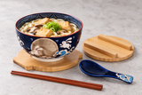 Bowl set serving udon with one unwrapped chopstick pair