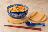 Bowl set serving chicken and vegetable rice with one unwrapped chopstick pair