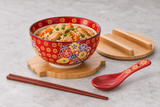 Bowl set serving chicken and vegetable rice with one unwrapped chopstick pair