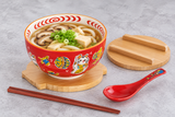 Bowl set serving mushroom and tofu udon with one unwrapped chopstick pair