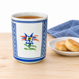 SH70-4 with tea, beside a separate plate of biscuits.