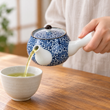 SN6-SM side-handle teapot pouring tea