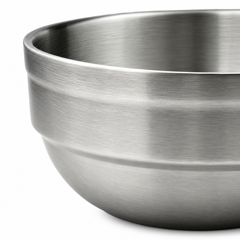 Close-up of the upper band and curved satin body of a dessert bowl.