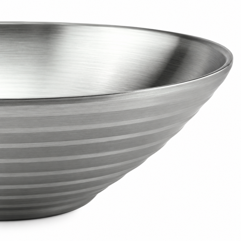 Close-up of the horizontal rings on a large V-shaped stainless steel bowl.