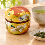 TCSH1C closed patterned tea container beside separate tea service accessories