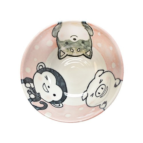 Overhead view of the pink bowl with cat, penguin and pig characters on a white-dotted pink inner border.