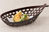 Brown boat-shaped basket with a small tempura assortment