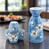 TSS74 floral sake bottle and four cups in a restaurant tabletop setting