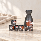 TSS79 rabbit and moon sake bottle and four cups on a restaurant counter