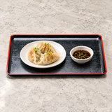 WB1517 black and red lacquer serving tray with dumplings and dipping sauce in separate dishes