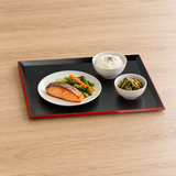 WB307 black and red lacquer serving tray with a salmon meal arranged in separate dishes