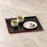 WB307 black and red lacquer serving tray with tea and mochi arranged in separate dishes
