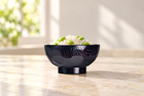 Black bowl with edamame rice