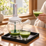 HARIO WTK-3812 kit with prepared green tea in its two clear cups, one lifted for serving