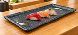 YG-5110SI Stone Ink melamine plate with three nigiri and its two gold-white end accents visible