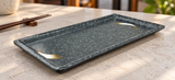 Empty YG-5110SI Stone Ink gray melamine plate on a light stone table