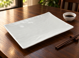 Empty YG-59139SW white rectangular melamine platter on a dark wood dining table