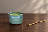YK536-GR: Fresh matcha in a restrained walnut-table setting.