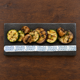 Gray arabesque ceramic platter with grilled vegetables