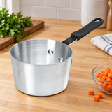 5.5 Qt Aluminum Sauce Pan with Bakelite Handle on a restaurant preparation counter