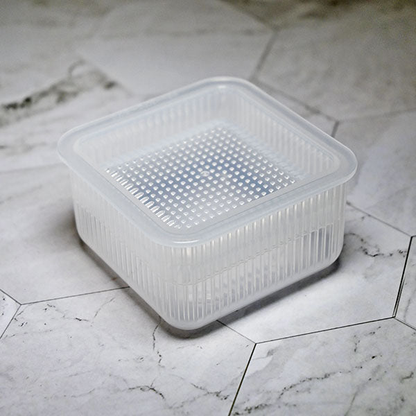Closed KK-697 square rice mold on a light marble-patterned counter
