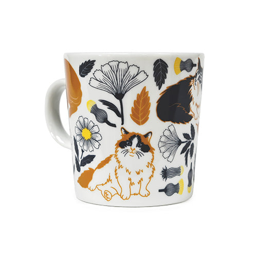Reverse view of orange tabby cat and flower mug