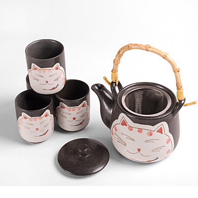 TPS113 — Open teapot with lid removed and strainer visible beside four cups