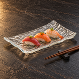 GF2-C clear rippled glass plate with nigiri in a warm tabletop setting