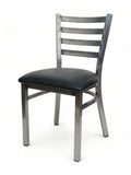Clear-finish metal restaurant chair with black padded seat