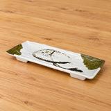 Oblique view of white melamine footed rectangular plate with olive accents on wood