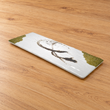 White rectangular melamine plate with olive accents on a tabletop