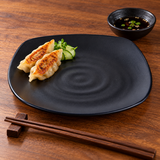 IT-H1288B black rounded-square ripple melamine plate with two gyoza and cucumber