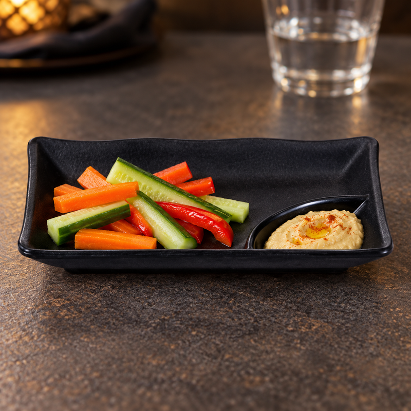 IT-Y301B black rectangular melamine plate with vegetable batons and hummus in its integrated corner well