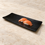 Black rectangular melamine platter with salmon nigiri