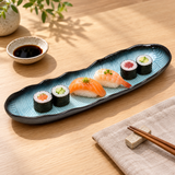 JX213-S blue and black scalloped rectangular with a sushi assortment