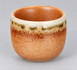 JX8-7 sake cup with orange interior in an elevated oblique view