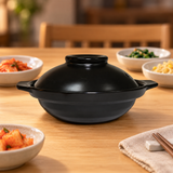 C4-BK black ceramic donabe in a dining setting