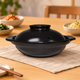 C6-BK black ceramic donabe in a dining setting