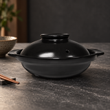 C6-BK black ceramic donabe in a dining setting
