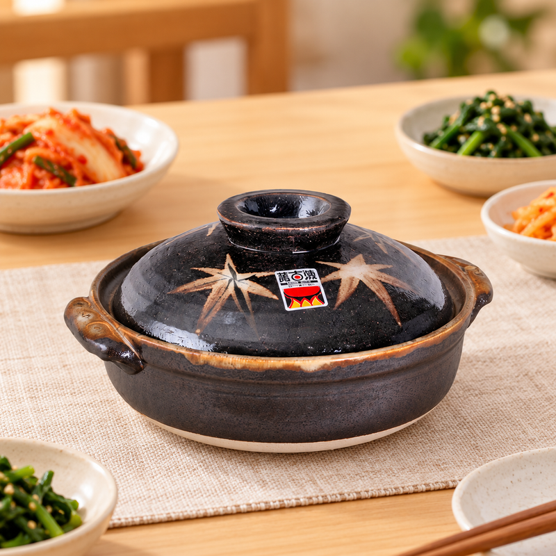 D6-ML maple-leaf donabe in a restaurant table setting